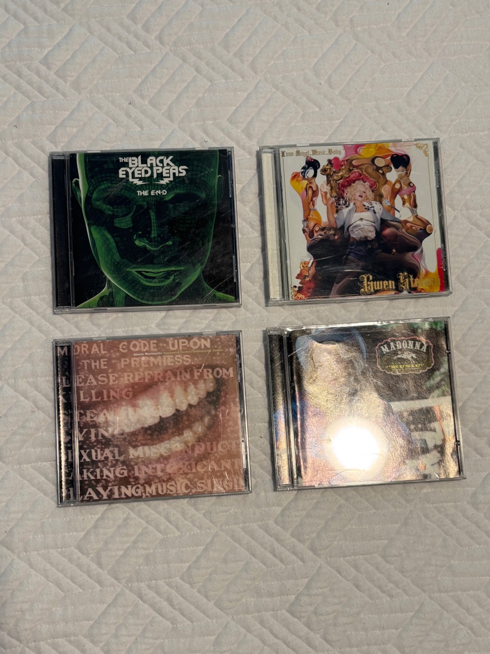 Four (4) Assorted CDs